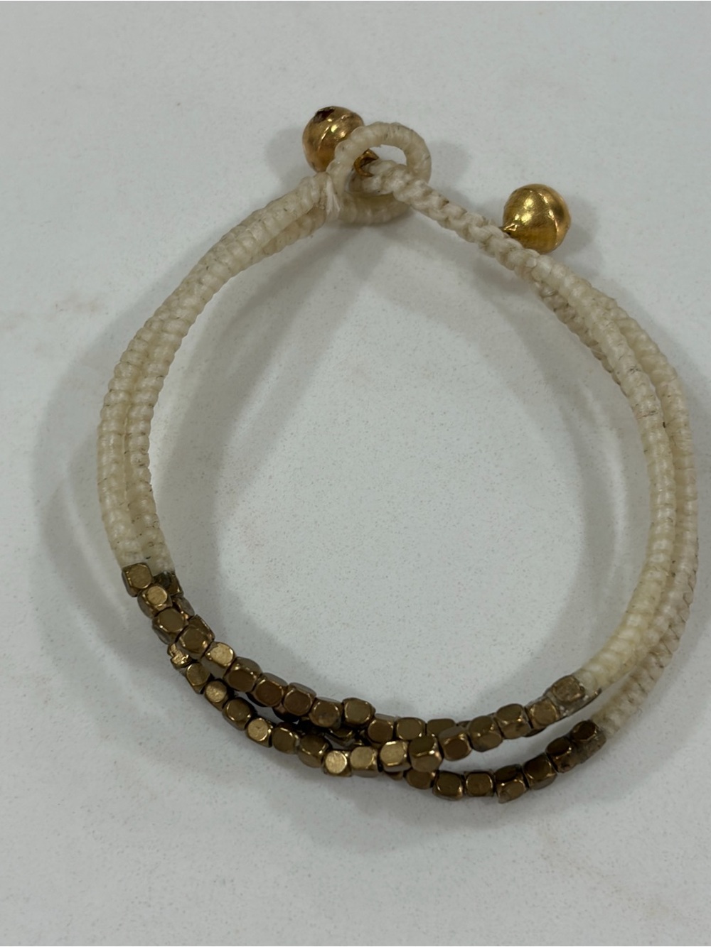 Handwoven Cream Cord Bracelet with Gold Bead Accent